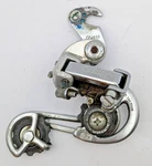 Raleigh Suntour 7 Gt Rear Derailleur Silver Long Cage W/ Removable Hook Hanger. Fixed Price $21.88.
