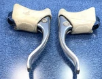 Campagnolo C-record Cobalto Brake Levers Lightly Used With Cracked White Hoods. Fixed Price $118.00.