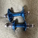 Blue Aluminum Sunshine Bmx Hubs Set 36 Hole Nut Attachment, Pair. Fixed Price $100.00.
